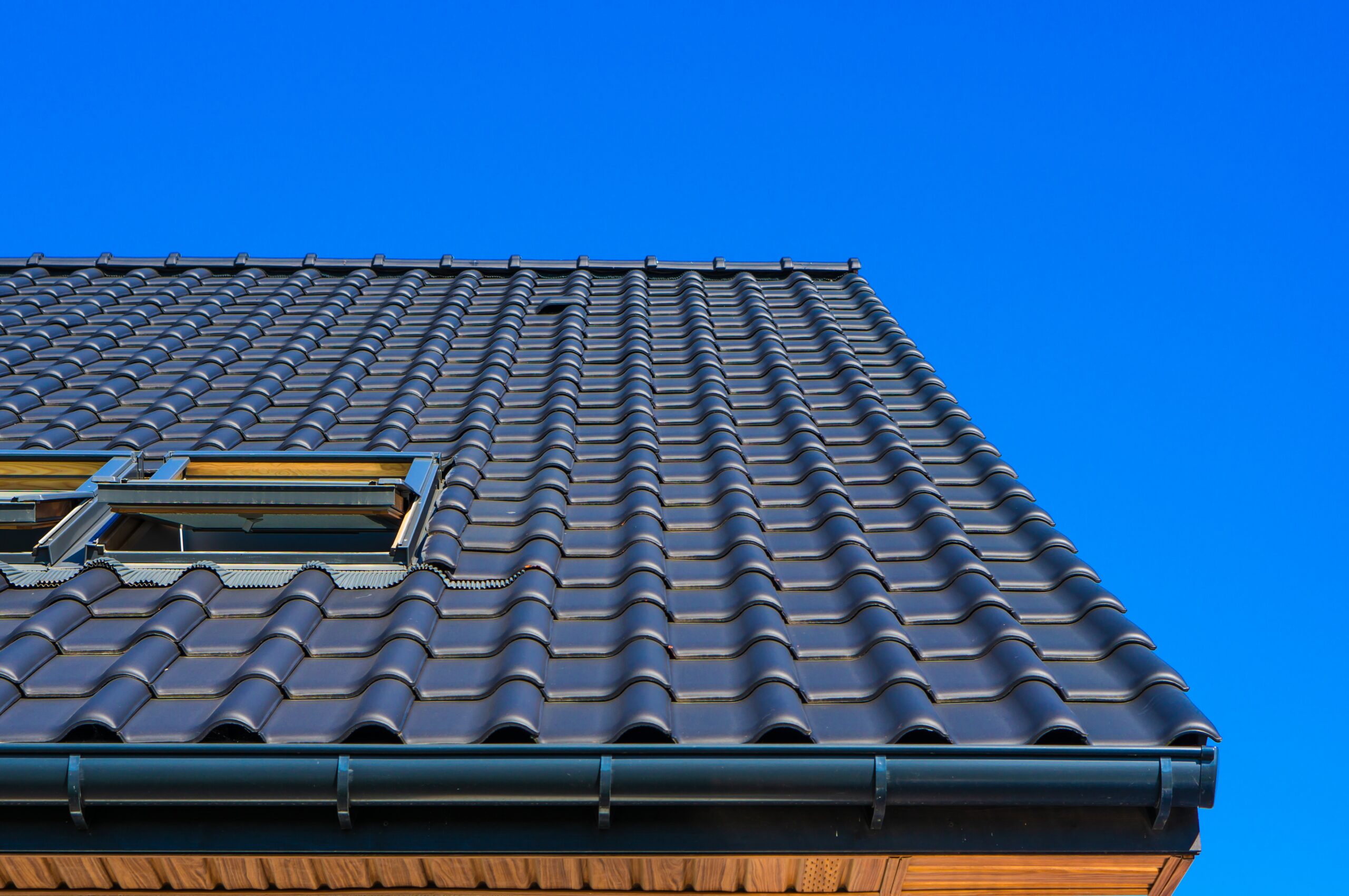 vertical low angle closeup shot black roof building scaled 1.jpg